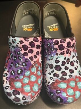 Dansko Multicolor Leopard Print Clogs in Purple, Teal, Red and Black